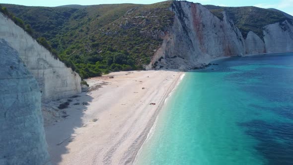 Amazing Fteri beach lagoon, Kefalonia, Greece. Cliff rock coastline in background