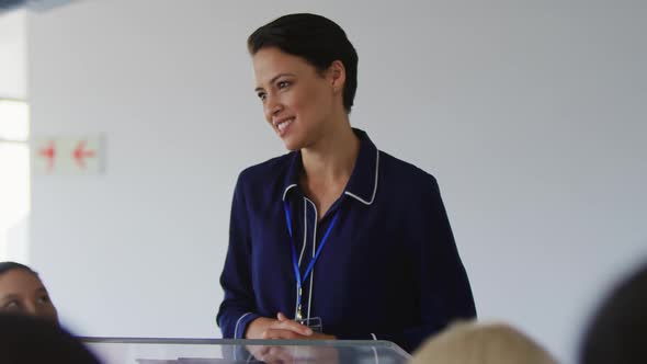 Female speaker addressing the audience at a business conference