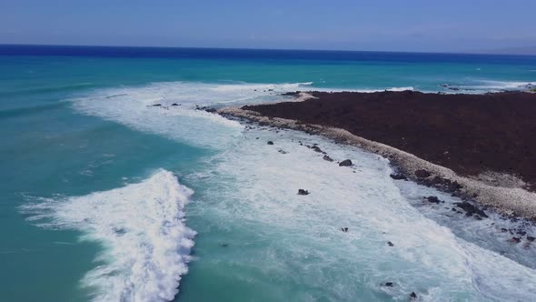 Flying Over The Rugged Coastline Of Hawaii