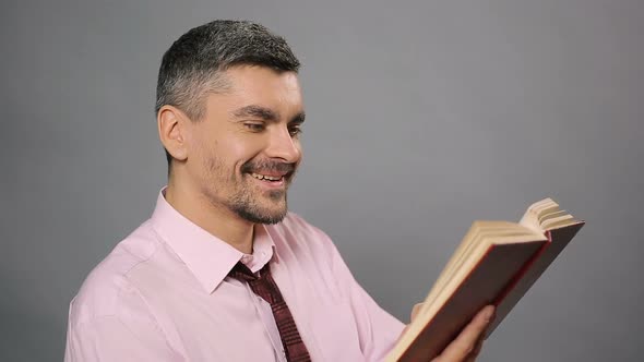 Relaxed Man Reading Interesting Book and Laughing Free Time Literature