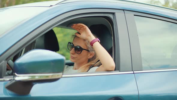 Sick Woman With Headache Sitting On Car.Depressed Tired Stressed Girl. Dissapointed Stressed Driver.