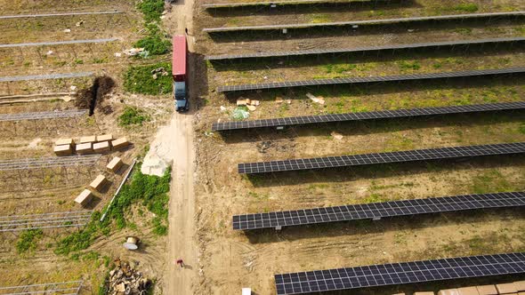 Aerial View of Electrical Power Plant Under Construction with Truck Delivering Assembly Parts for