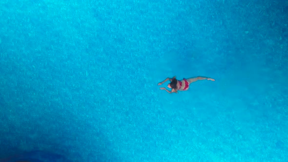 Girl Swimming in the Pool
