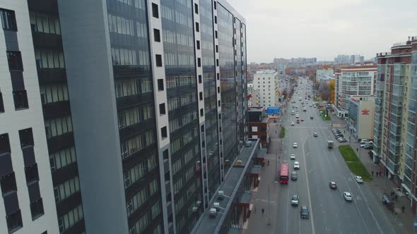 Long Road with Vehicles and Elegant Multistory Building