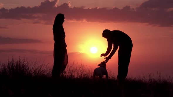 Family with French Bulldog Outdoors