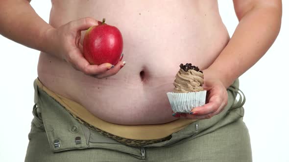 Fat Woman Holding Cake and an Apple