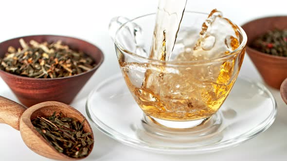 Super Slow Motion Shot of Pouring Tea on White Background at 1000 Fps