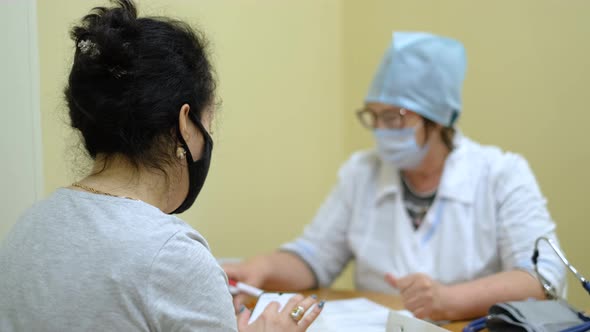 Female Patients Undergoing Questioning with Coronavirus Nurse During Pandemic