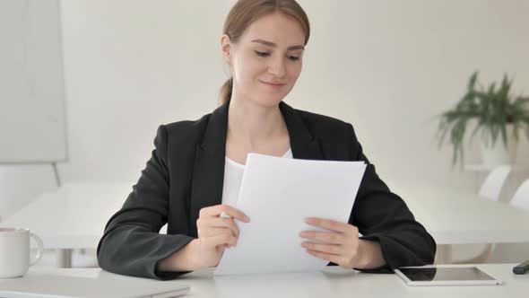 Young Businesswoman Celebrating Success of Contract