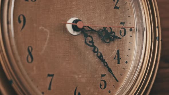 Old Retro Wall Clock with Moving Second Hand on Wooden Background