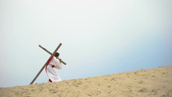 Jesus With Heavy Wooden Cross Hardly Walking, Biblical Story of Crucifixion