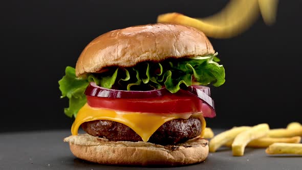 Beef burger with falling french fries