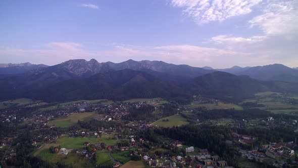 Flight over the city in the mountains, Tatry, Giewont, Aerial View