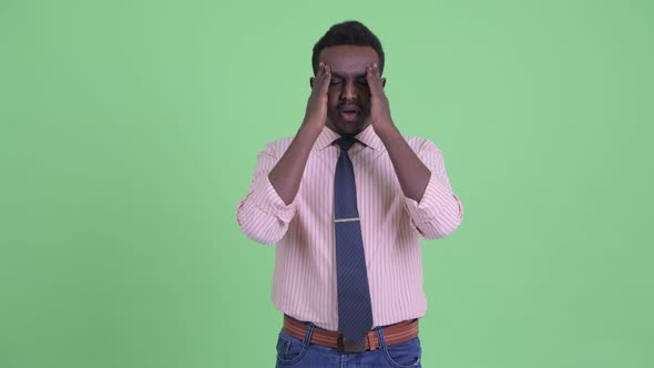 Stressed Young African Businessman Having Headache