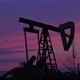 Oil pump silhouette drilling in the sunset. Fossil fuel energy pumpjack at work. - VideoHive Item for Sale