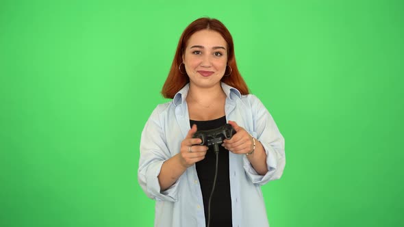 Funny Happy Woman Playing Video Game with Joystick on Green Screen 4K
