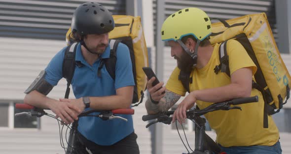 Bicycle Messengers Check Smartphone