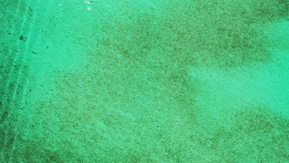 Aerial drone shot seascape of marine sea view beach time by aqua blue ocean with white sand backgrou