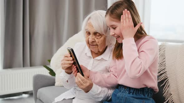 Granddaughter and Grandmother with Smartphone