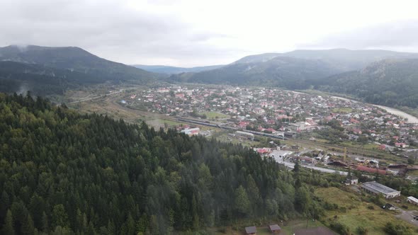 Village in the Carpathian Mountains in Autumn. Slow Motion, Aerial View