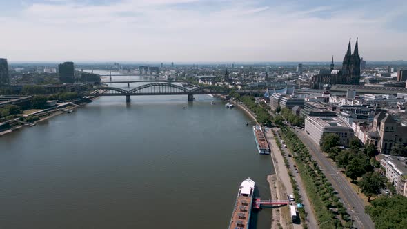 Cologne, North Rhine-Westphalia, Germany - Panorama aerial bird drone flight towards the Köln Dom an