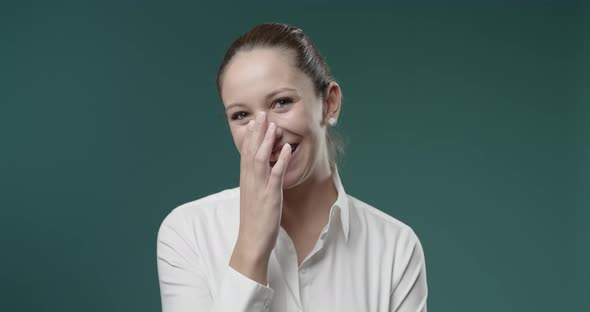 Cheerful woman laughing out loud and enjoying, expression and emotions concept