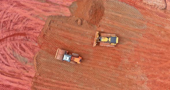 Aerial Over View Prepare a Construction Site for a Building Earth Moving the Truck and Bulldozer