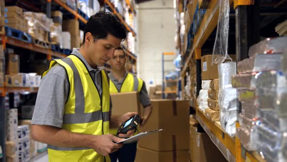 Worker scanning products with a barcode scanner