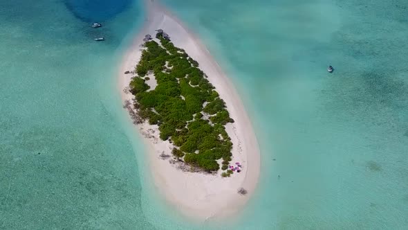 Aerial drone seascape of tropical tourist beach break by blue sea with sand background