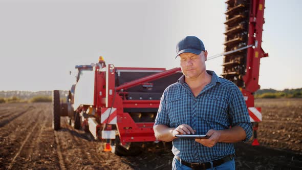 Farmer Using Digital Tablet