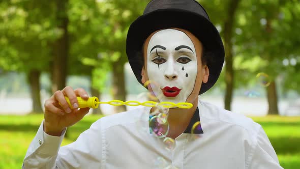 Fun Mime Blowing Soap Bubbles Outdoors