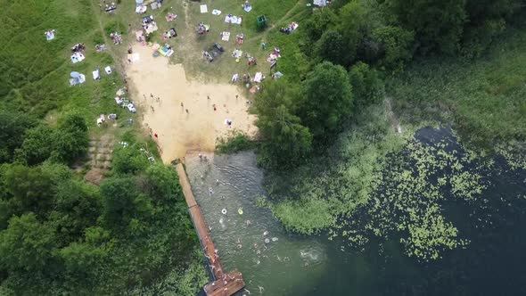 Drone Video of People Swimming in the Lake