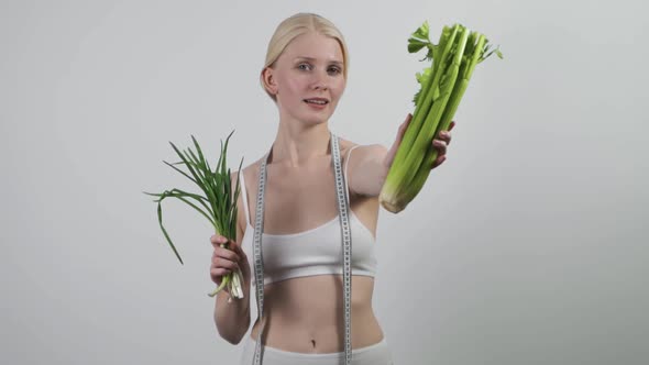 Young Woman with Vegetables Isolated on White Background