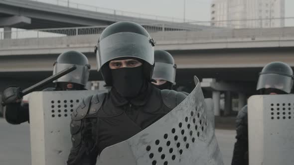 Riot Policeman Posing for Camera