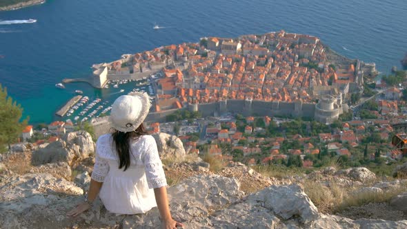 Woman Tourist Looking at City of Dubrovnik Croatia