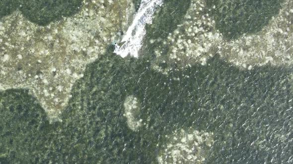 Vertical Video Kitesurfing Near the Shore of Zanzibar Tanzania Aerial View