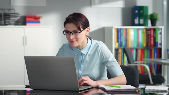 Portrait of Young Female Teacher Having Video Lesson on Laptop