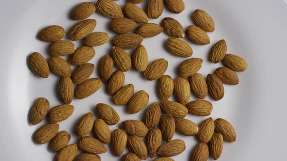 Cinematic, rotating shot of almonds on a white surface - ALMONDS 001