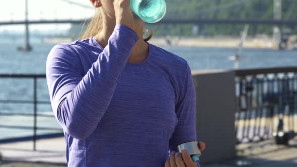 Motion Shoot of Woman Drinking Water on the Background