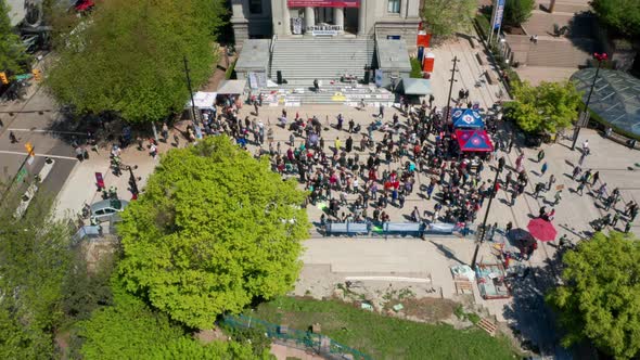 Aerial view of an anti-mask political rally as protesters demand No New Normal, UHD dolly in to crow