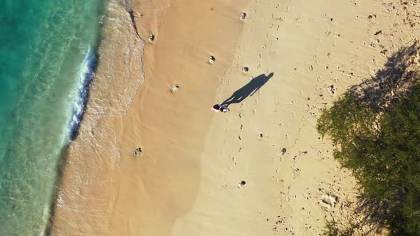 Young couple posing on luxury resort beach trip by transparent sea with bright sandy background of B