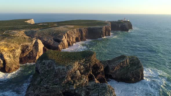 Flying Over Flat Rocks at Cape Saint Vincent, Portugal. Seagulls Flying Around Among Raging Atlantic