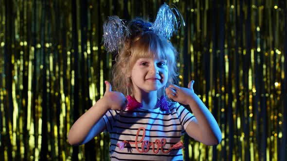 Futuristic Hipster Teen Girl Showing Thumbs Up in Slow Motion at Disco Party Club in Blue Neon Light