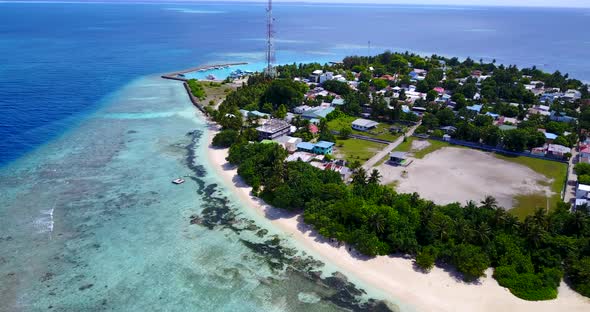 Natural birds eye copy space shot of a paradise sunny white sand beach and aqua blue water background