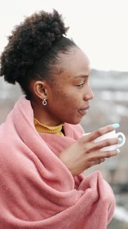 Black Woman Drinking Coffee in the Morning