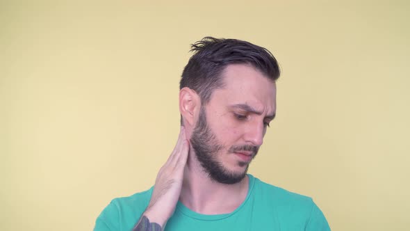 Young Bearded Man Suffering From Neck Pain