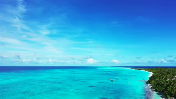 Aerial panorama of perfect island beach trip by blue sea with bright sandy background of a dayout ne