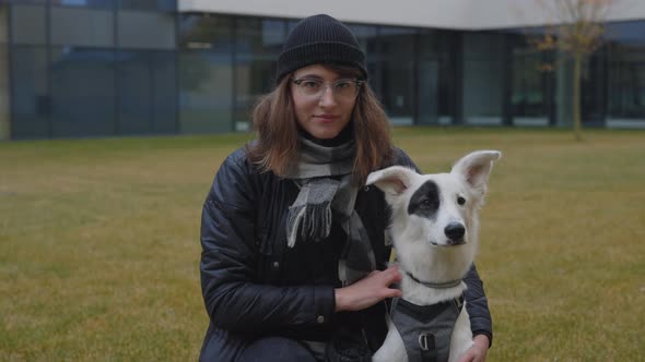 Beautiful Woman Posing at Green Park with Her White Dog