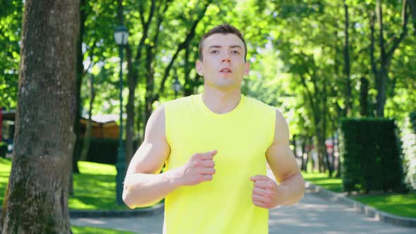 Man Taking Break in Jogging in Park