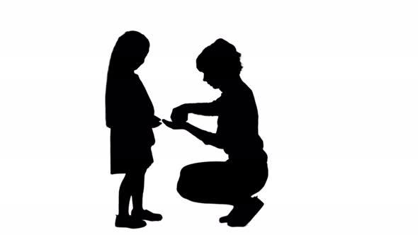 Silhouette Worried Mother Giving Medicine To Her Daughter Track Matte